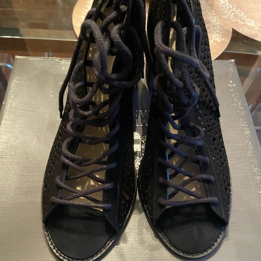 Women’s black  tie up ankle bootie. Zip up in back
